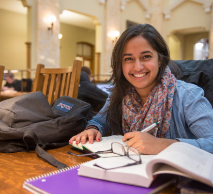 Student studying at Carnegie Library Reading Room